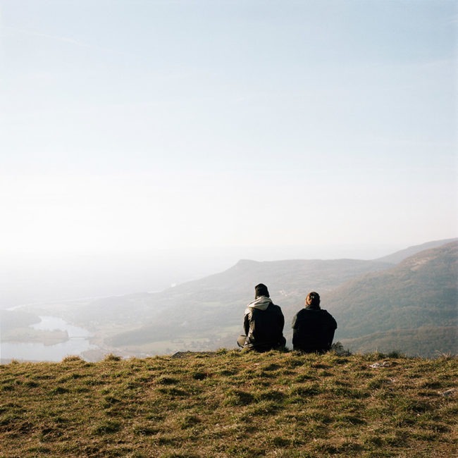 Two teenagers look at the landscape
