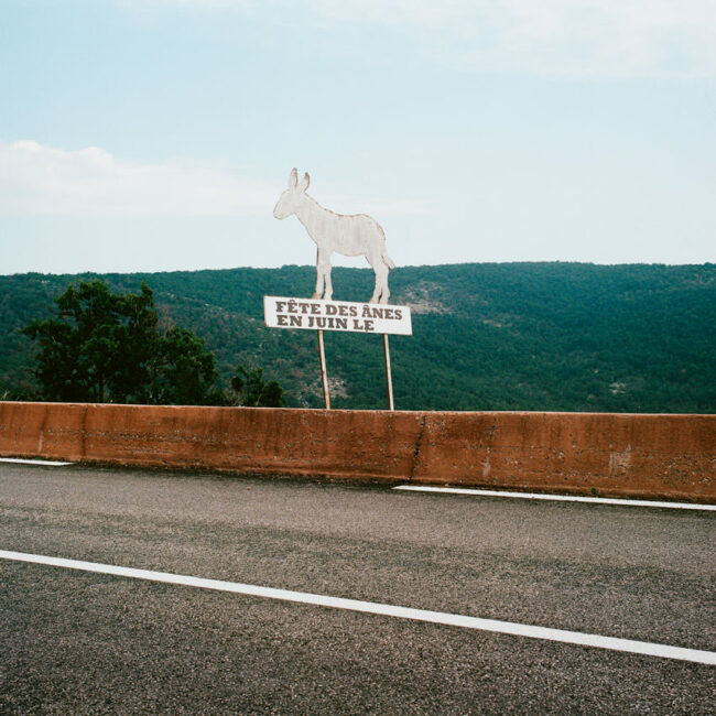 The road sign donkeys festival in June without of Escragnolles